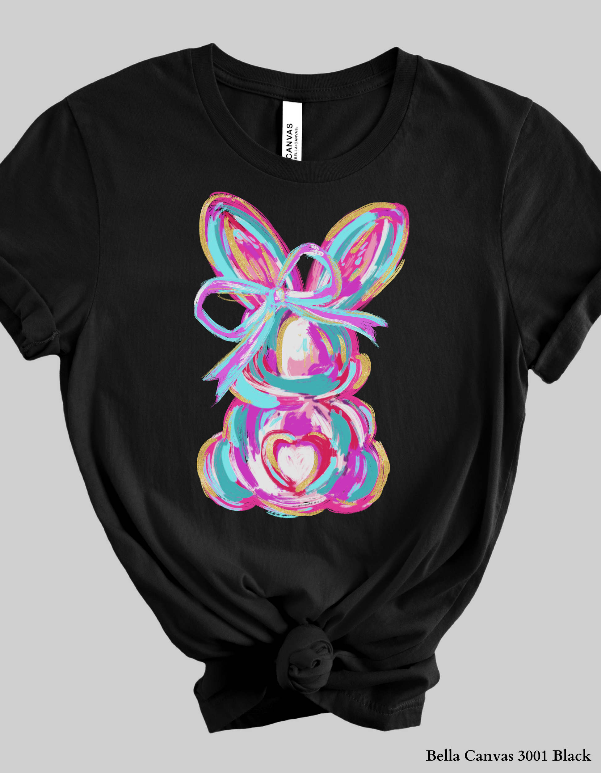 Easter T-Shirt & Sweatshirt flat lay featuring the Color Splash Bunny design in pastel tones. A cozy and stylish outfit for spring and Easter festivities.