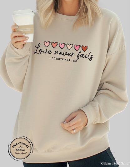 Love Never Fails Valentine Shirt – 1 Corinthians 13:8 Heart Design (Adult Sizes S–2XL)
