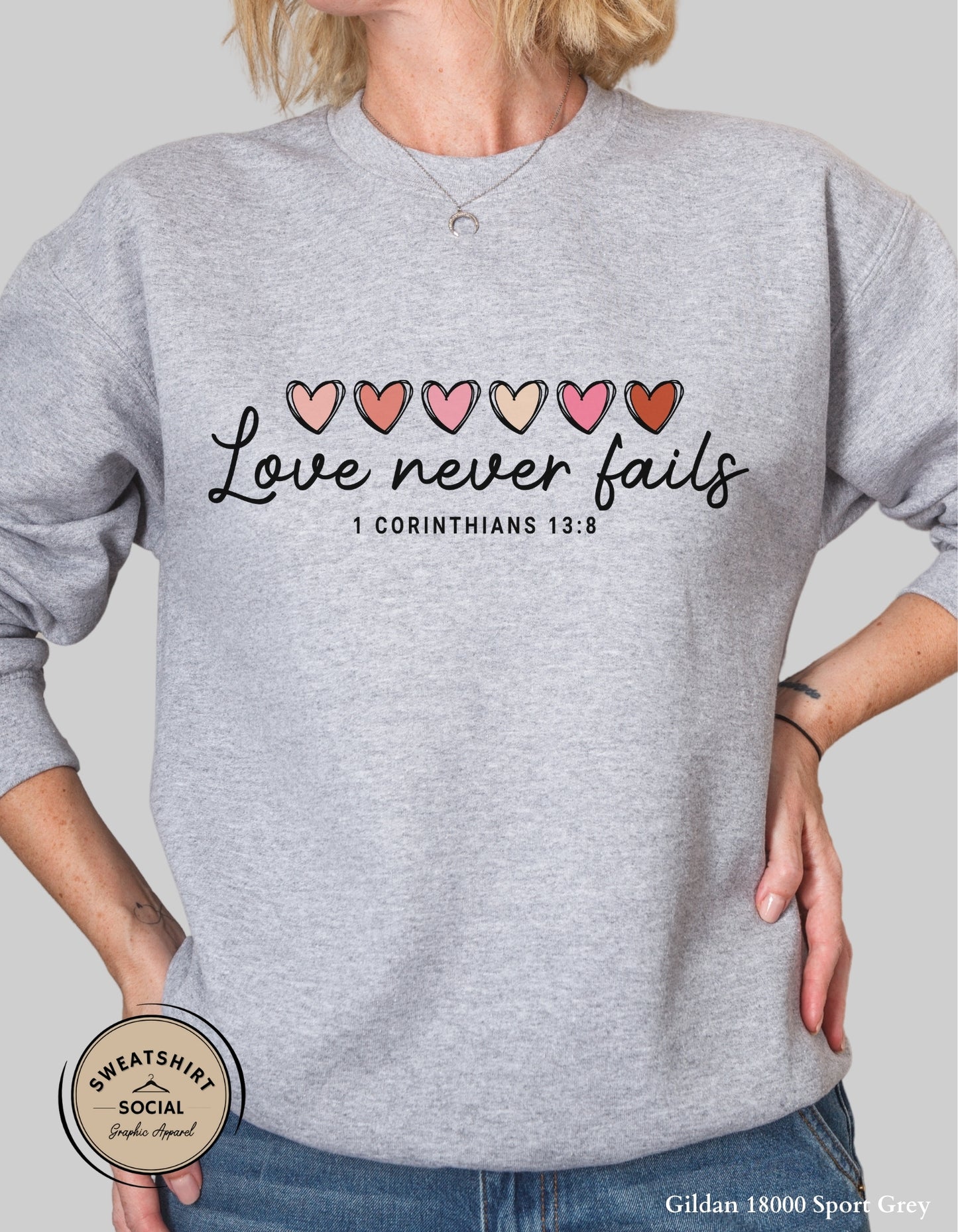 Love Never Fails Valentine Shirt – 1 Corinthians 13:8 Heart Design (Adult Sizes S–2XL)