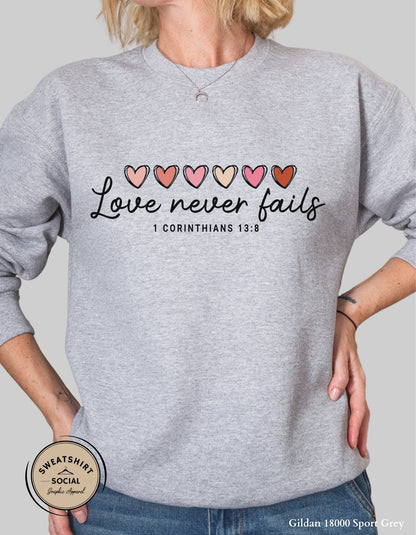 Love Never Fails Valentine Shirt – 1 Corinthians 13:8 Heart Design (Adult Sizes S–2XL)