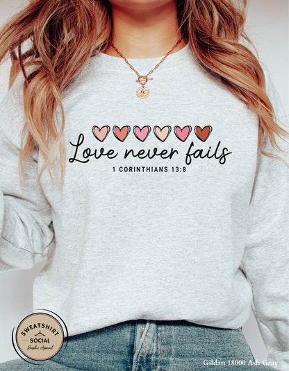 Love Never Fails Valentine Shirt – 1 Corinthians 13:8 Heart Design (Adult Sizes S–2XL)