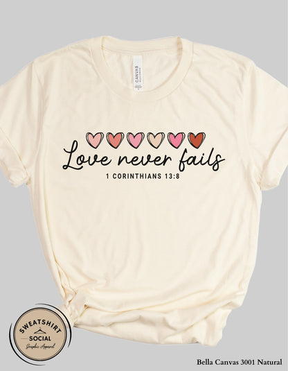 Love Never Fails Valentine Shirt – 1 Corinthians 13:8 Heart Design (Adult Sizes S–2XL)
