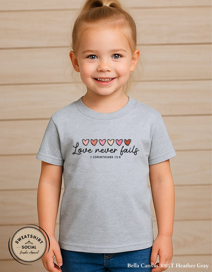 Love Never Fails Valentine Shirt for Kids – 1 Corinthians 13:8 Design (Infant–Youth Sizes)