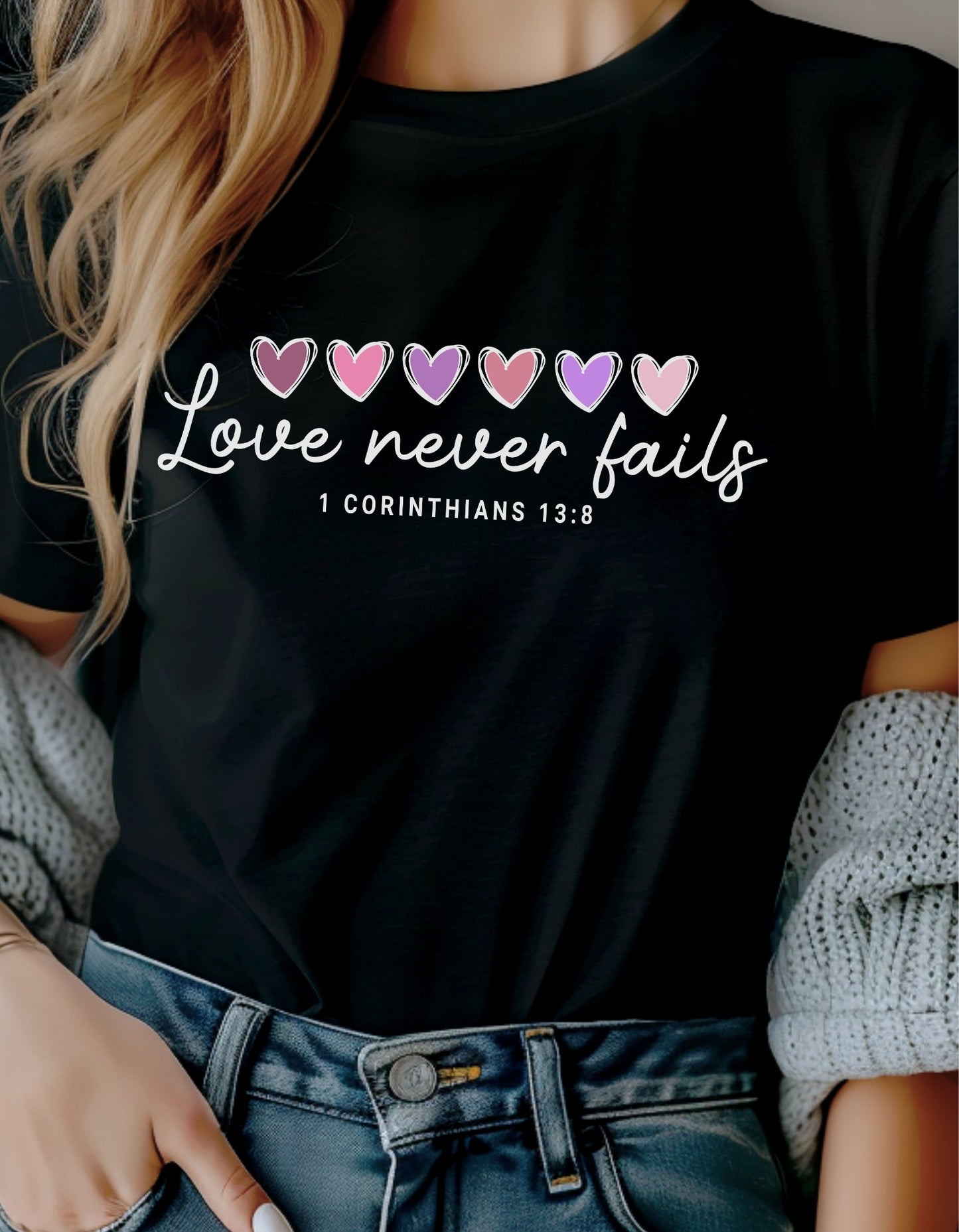 Love Never Fails White Valentine Shirt – 1 Corinthians 13:8 Heart Design (Adult Sizes S–2XL)