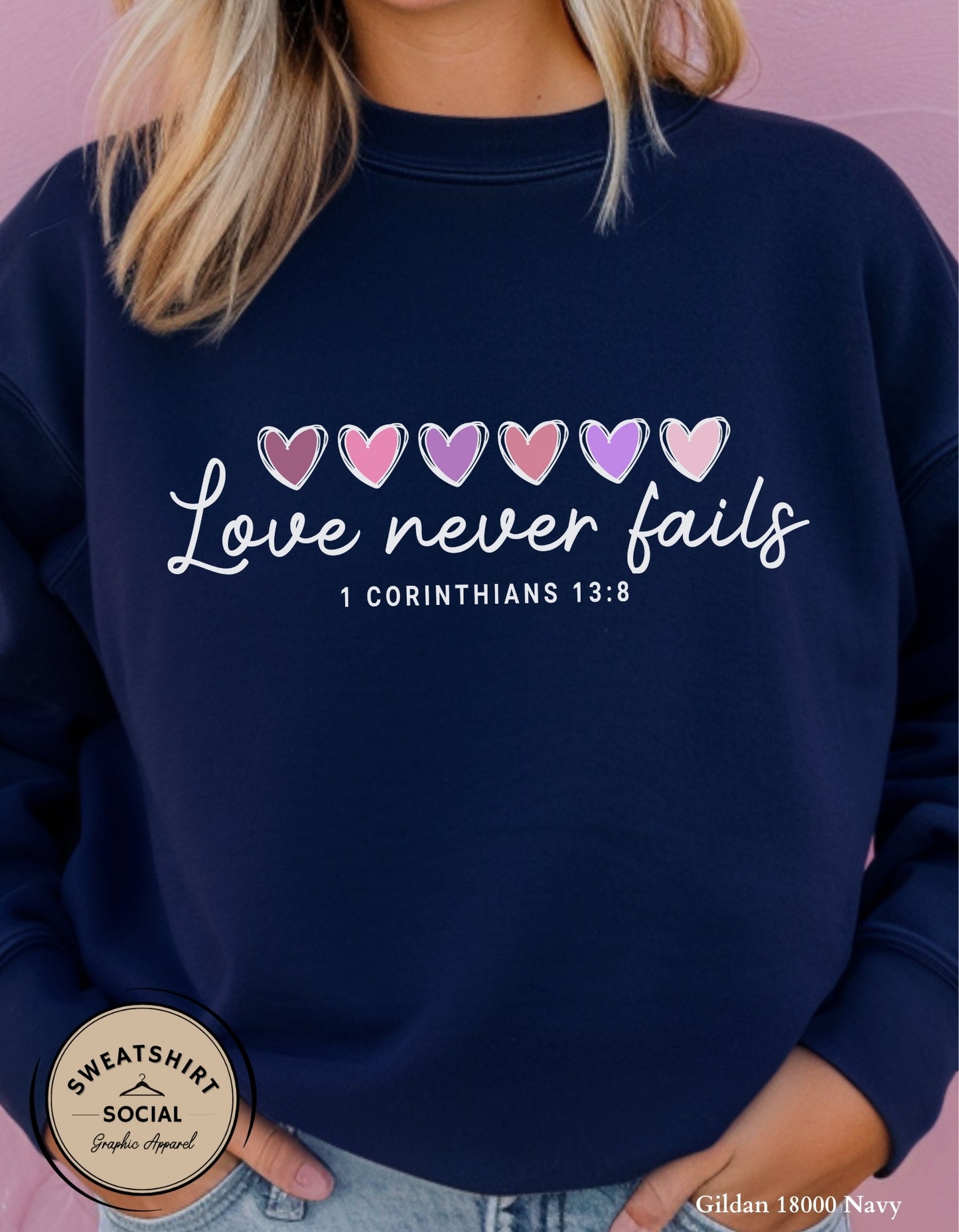 Love Never Fails White Valentine Shirt – 1 Corinthians 13:8 Heart Design (Adult Sizes S–2XL)