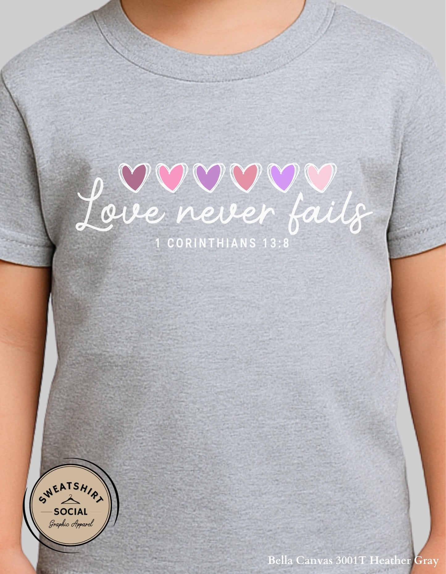 Love Never Fails White Valentine Shirt for Kids – 1 Corinthians 13:8 Design (Infant–Youth Sizes)