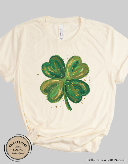 Gold Brushstroke Shamrock T-Shirt or Sweatshirt – Artistic St. Patrick’s Day Clover Graphic (Adult Sizes S–2XL)